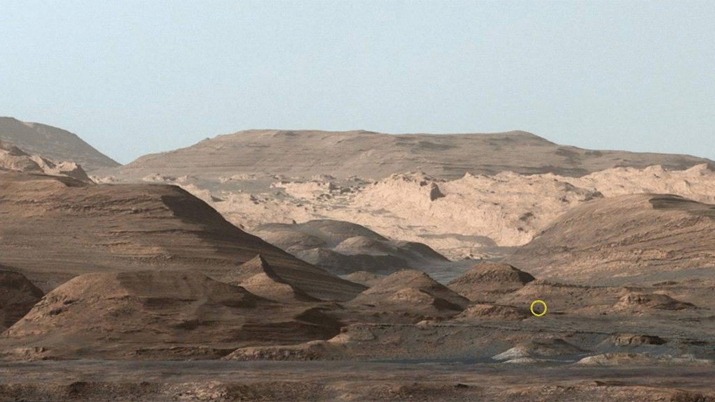 A wide angle view of the mountainous surface of Mars